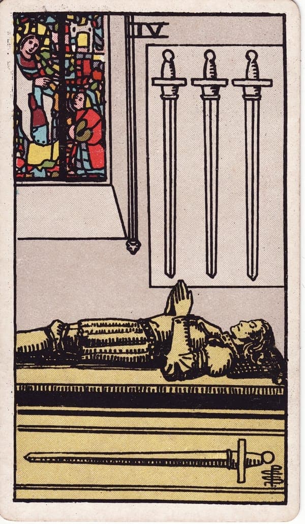 Four of Swords tarot card: In a quiet chapel, a knight lies carved in effigy on his tomb, hands raised in prayer.