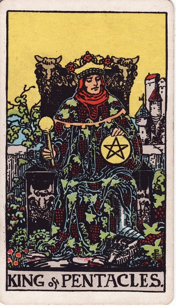 King of Pentacles tarot card: A king sits amid abundance so complete his robe's grapevines merge with the garden's real vines — wealth grown indistinguishable from its owner.