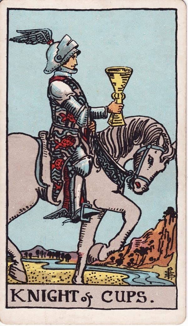 Knight of Cups tarot card: A knight in ornate armor rides a calm gray horse at a walking pace, a golden cup carried level and steady before him — an offering, not a trophy.
