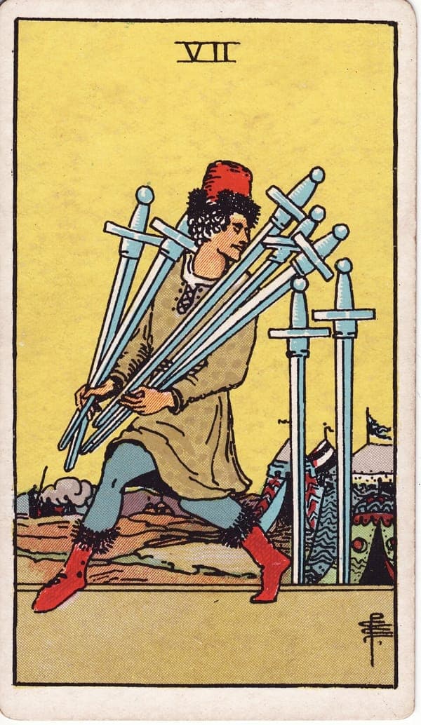 Seven of Swords tarot card: A man in soft boots tiptoes away from a camp of bright tents, five swords bundled awkwardly in his arms, his glance thrown back over his shoulder.