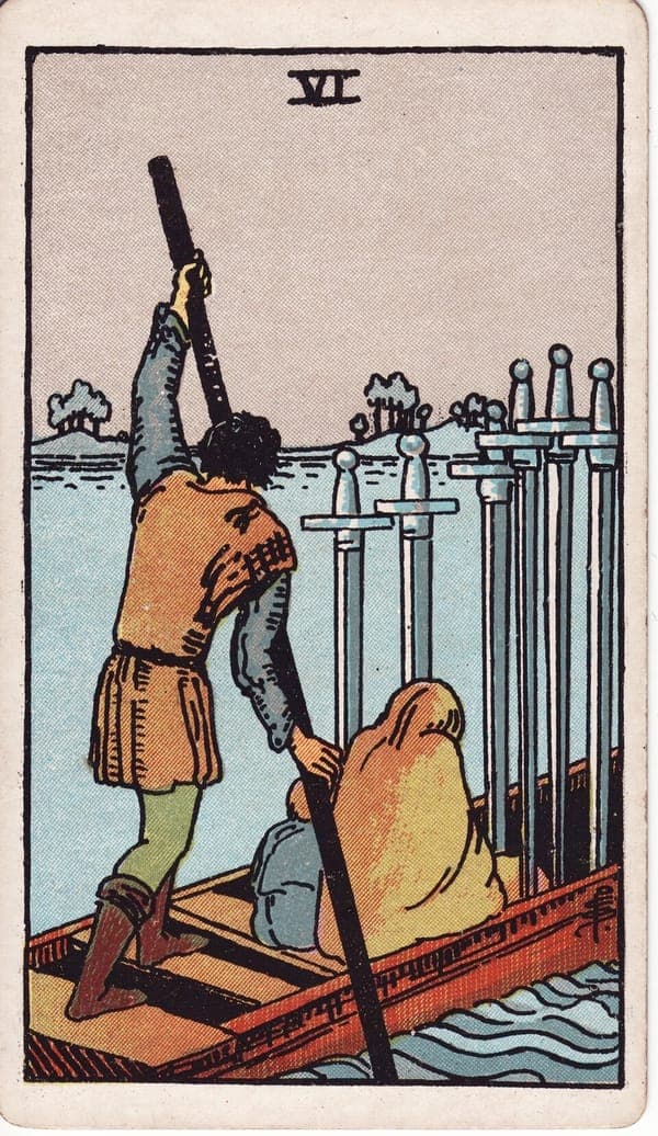 Six of Swords tarot card: A ferryman poles a low boat across water; a hooded woman and small child sit before him, faces hidden.