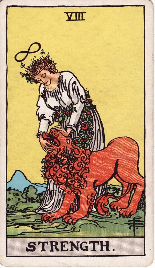 Strength tarot card: A woman in a white robe calmly closes — or opens — the jaws of a lion, a garland of flowers at her waist and the infinity symbol above her head, echoing The Magician.