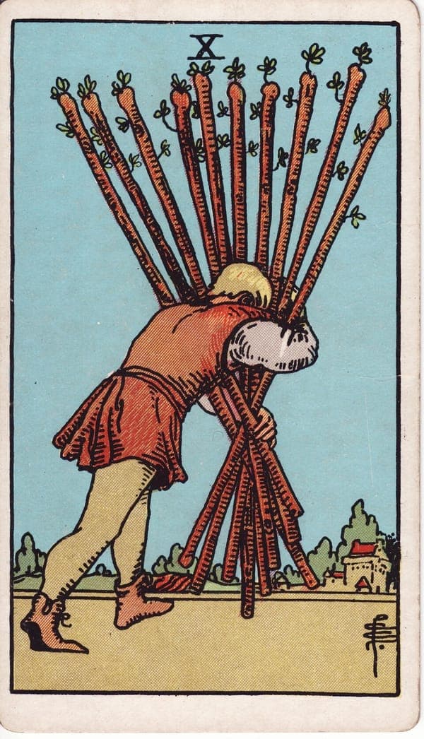 Ten of Wands tarot card: A figure bent double hauls ten flowering staves in an awkward armful, so bunched they block the view ahead.