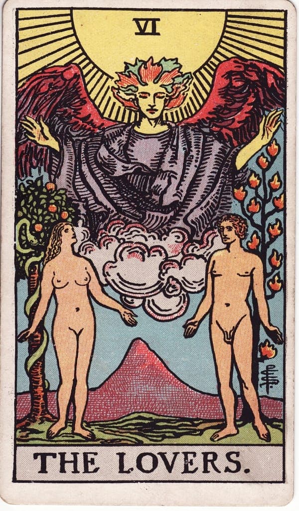 The Lovers tarot card — A naked man and woman stand in a garden beneath a great angel — Raphael — whose blessing pours down 