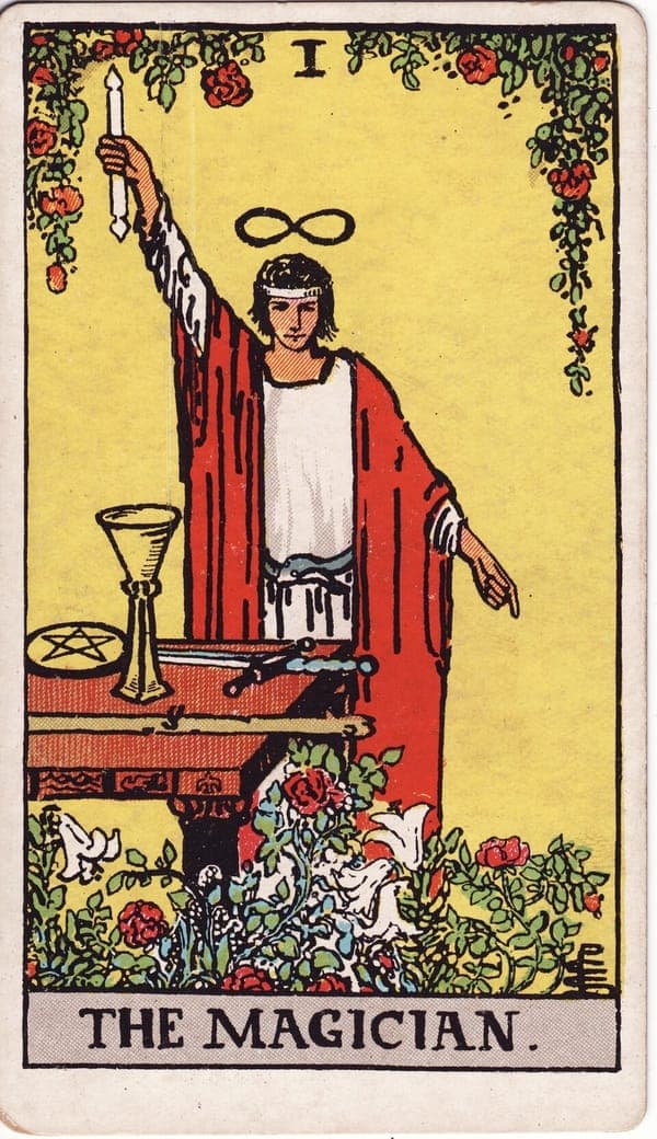 The Magician tarot card — A figure stands with one arm raised to the heavens and one pointing to the earth — 'as above, so bel