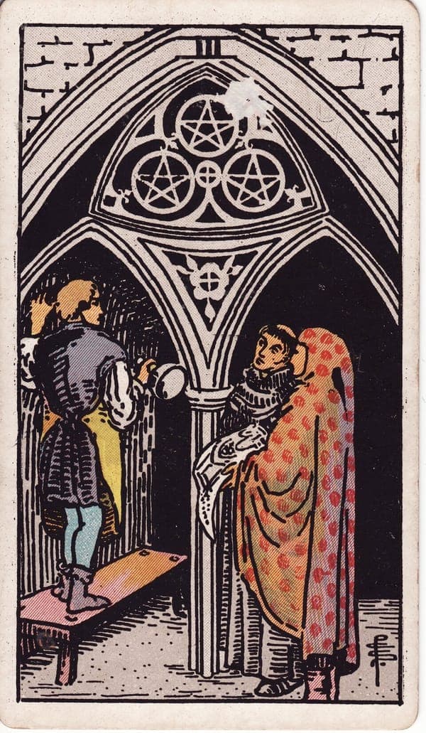 Three of Pentacles tarot card: In a shadowed cathedral, a young mason stands on a bench beneath an archway carved with three pentacles, chisel in hand, while a monk and a hooded architect holding the plans look up in consultation.