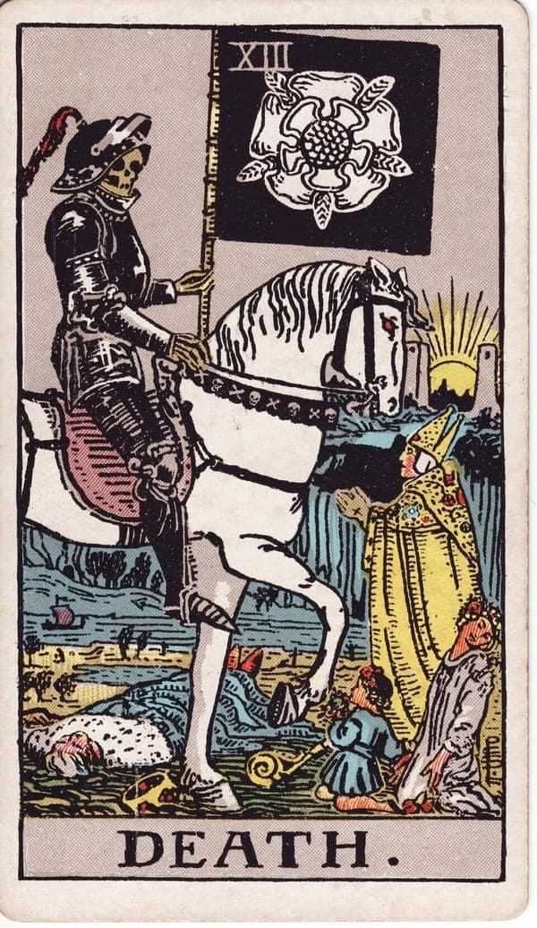 Death tarot card — A skeleton in black armour rides a white horse, carrying a banner with a white five-petaled rose — l